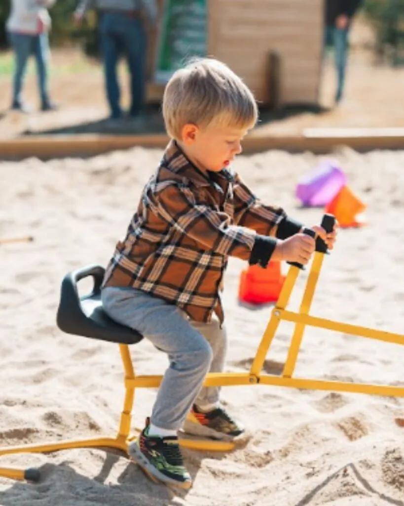 Children digging in the giant sandbox