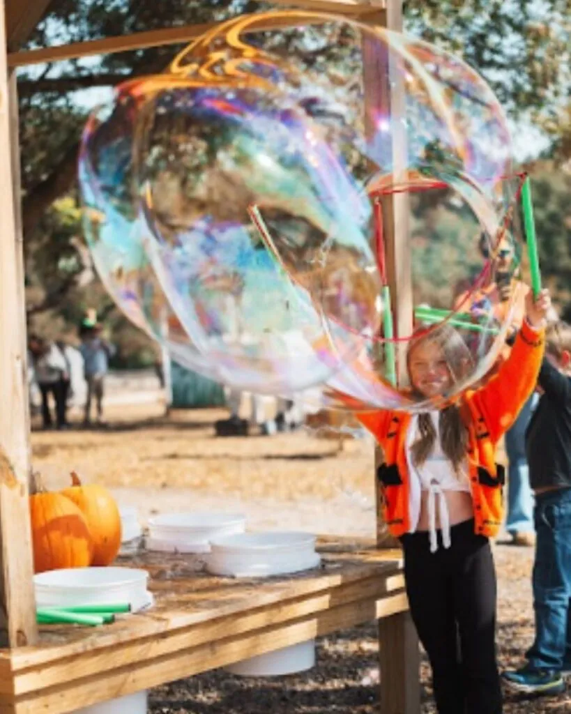 Kids playing at the bubble station